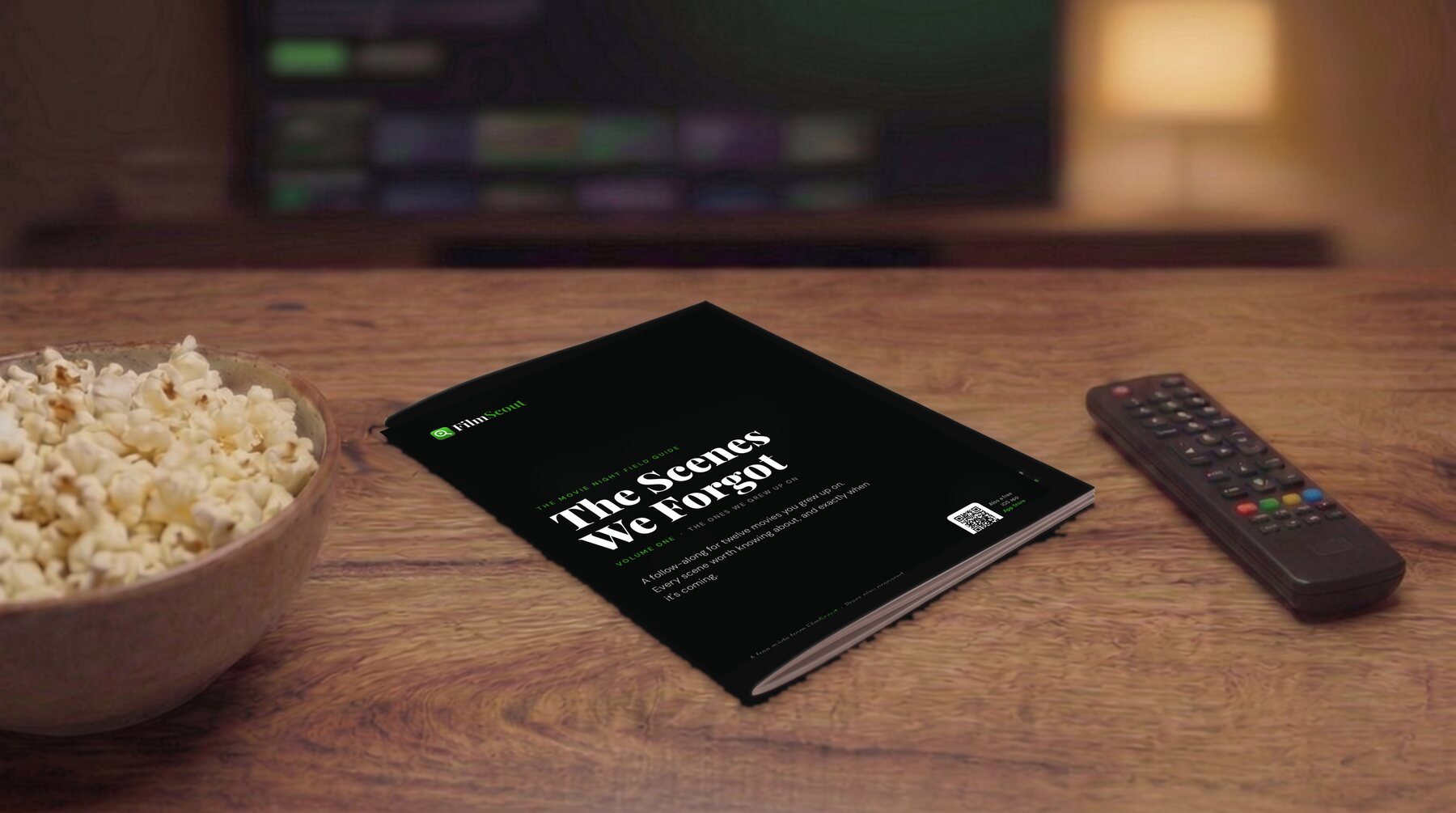 The Scenes We Forgot, a stapled booklet on a coffee table with popcorn and a remote.